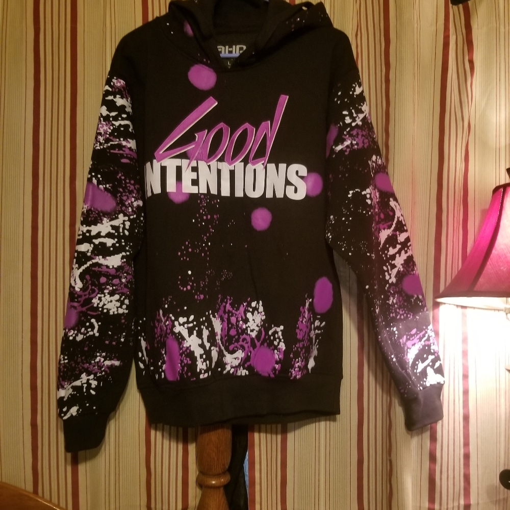 Good intentions hoodie with spray paint graphics on it.